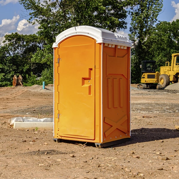 what is the cost difference between standard and deluxe porta potty rentals in Hallett